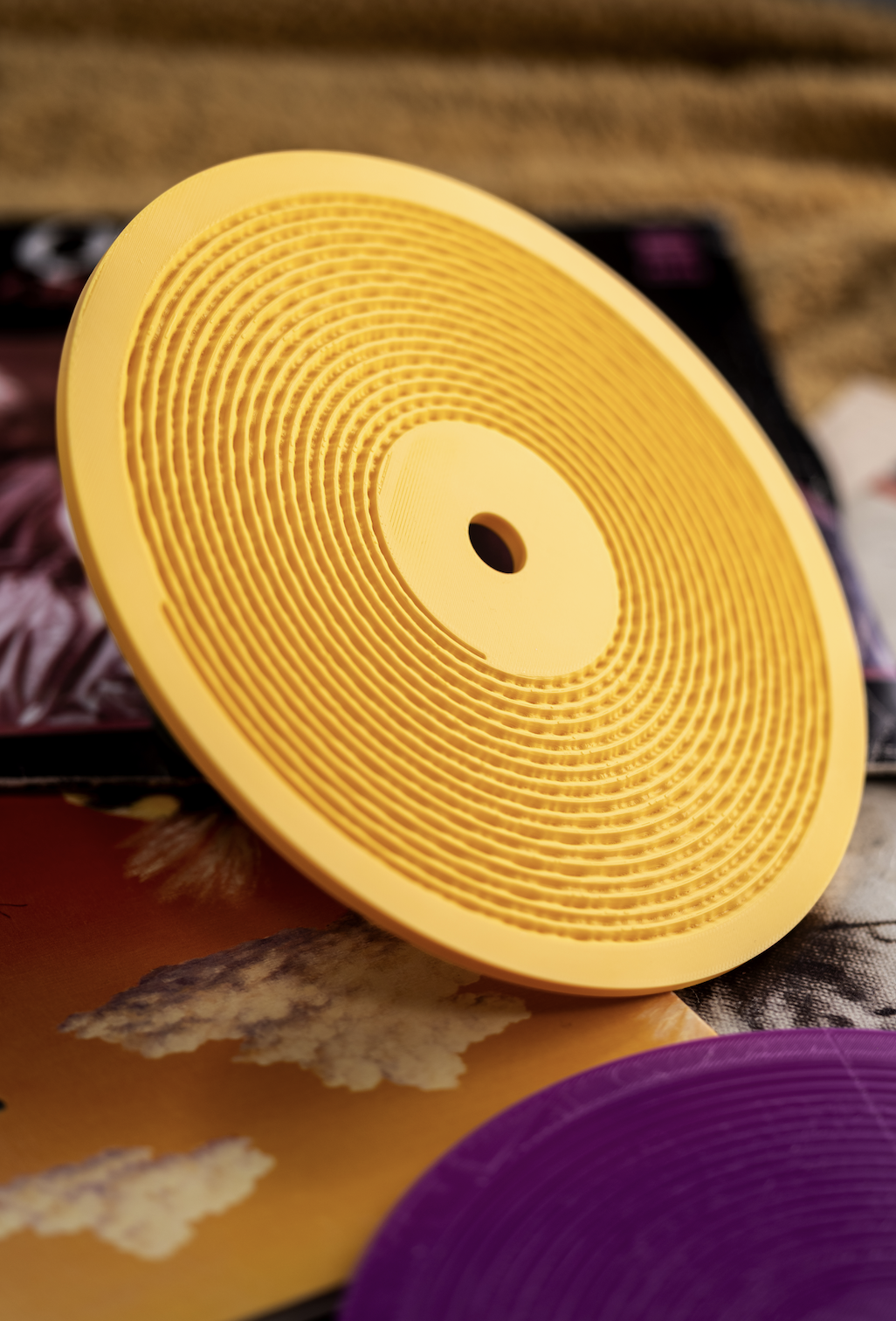 Close-up of a yellow Kräftsound development print showing its printed groove walls
